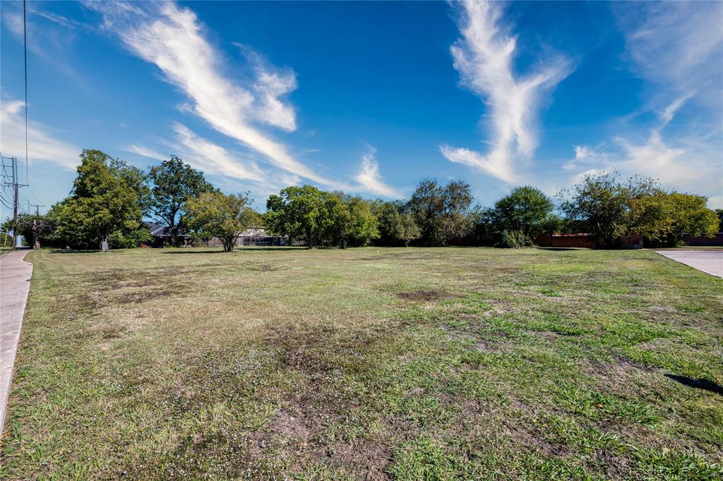 2640 North Shiloh Road Garland, TX 75044 - Photo 5 of 17 a view of a garden with a building