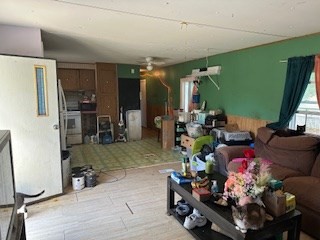 51 Monson Turnpike Road, Unit 1015 Ware, MA 01082 - Photo 6 of 9 a room with lots of furniture and a chandelier
