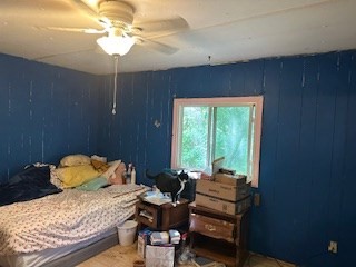 51 Monson Turnpike Road, Unit 1015 Ware, MA 01082 - Photo 9 of 9 a bedroom with a bed and a chandelier