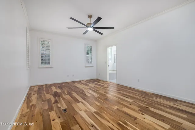 a bathroom with a sink toilet a mirror and window