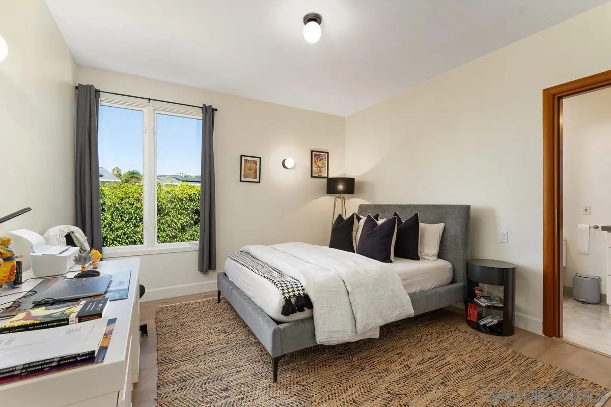 7911 El Paseo Grande La Jolla, CA 92037 - Photo 11 of 32 a bedroom with a bed and a window