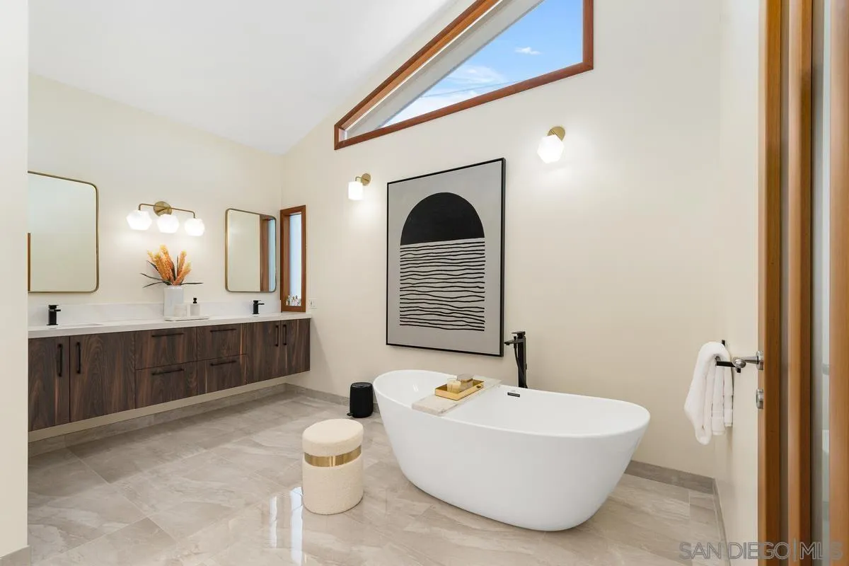 7911 El Paseo Grande La Jolla, CA 92037 - Photo 16 of 32 a bathroom with a bathtub and a sink