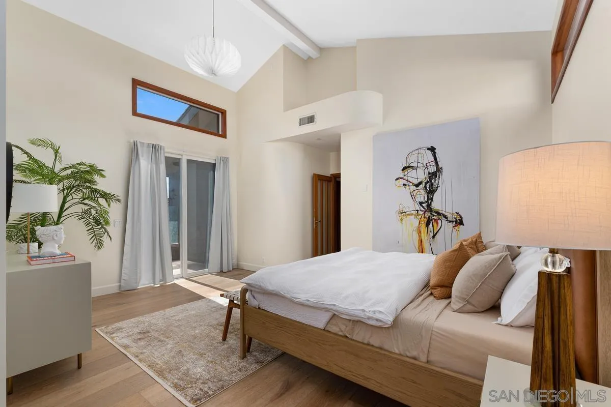 7911 El Paseo Grande La Jolla, CA 92037 - Photo 17 of 32 a bedroom with a bed and a couch