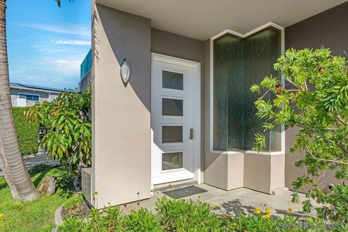 7911 El Paseo Grande La Jolla, CA 92037 - Photo 2 of 32 front view of a house with a potted plant and a potted plant