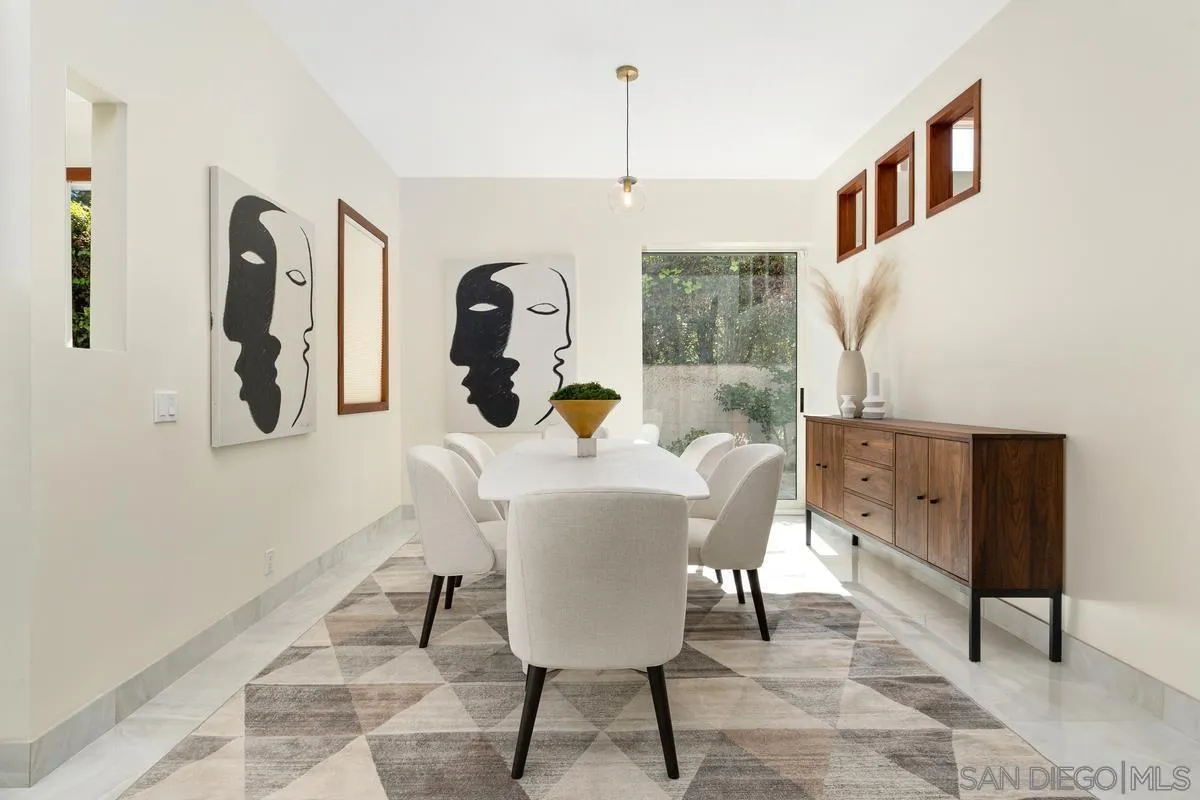 7911 El Paseo Grande La Jolla, CA 92037 - Photo 21 of 32 a view of a dining room with furniture