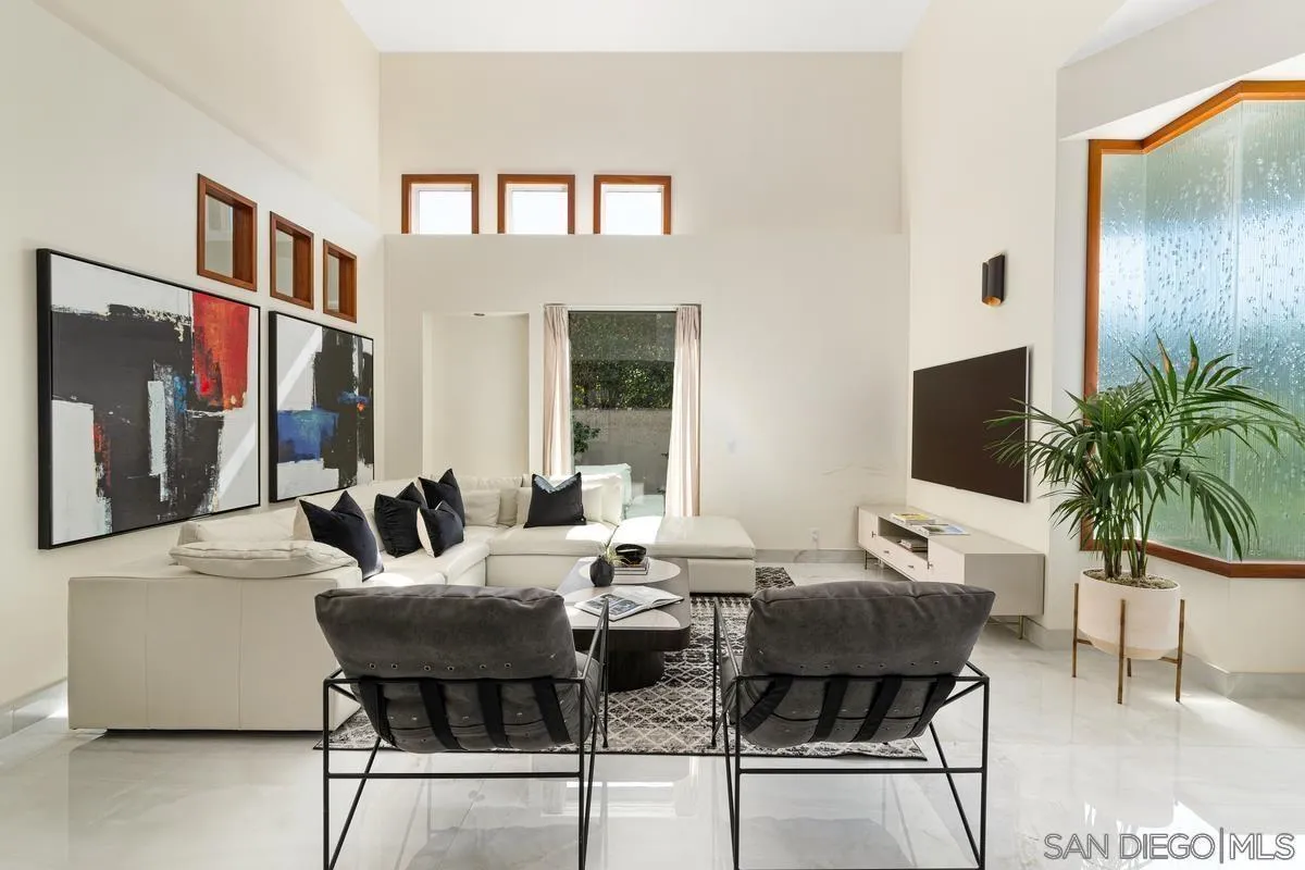 7911 El Paseo Grande La Jolla, CA 92037 - Photo 23 of 32 a view of a dining room with furniture and wooden floor