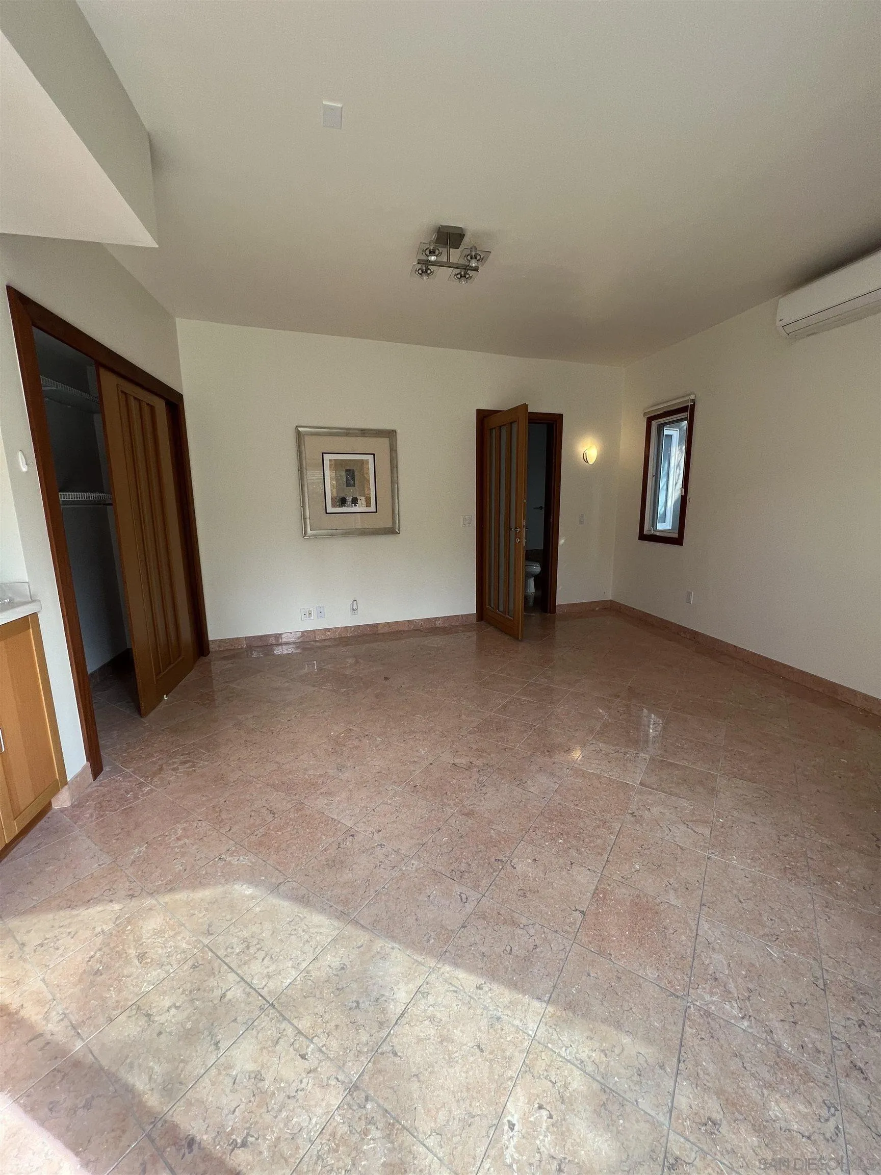 7911 El Paseo Grande La Jolla, CA 92037 - Photo 28 of 32 a view of a livingroom with a staircase