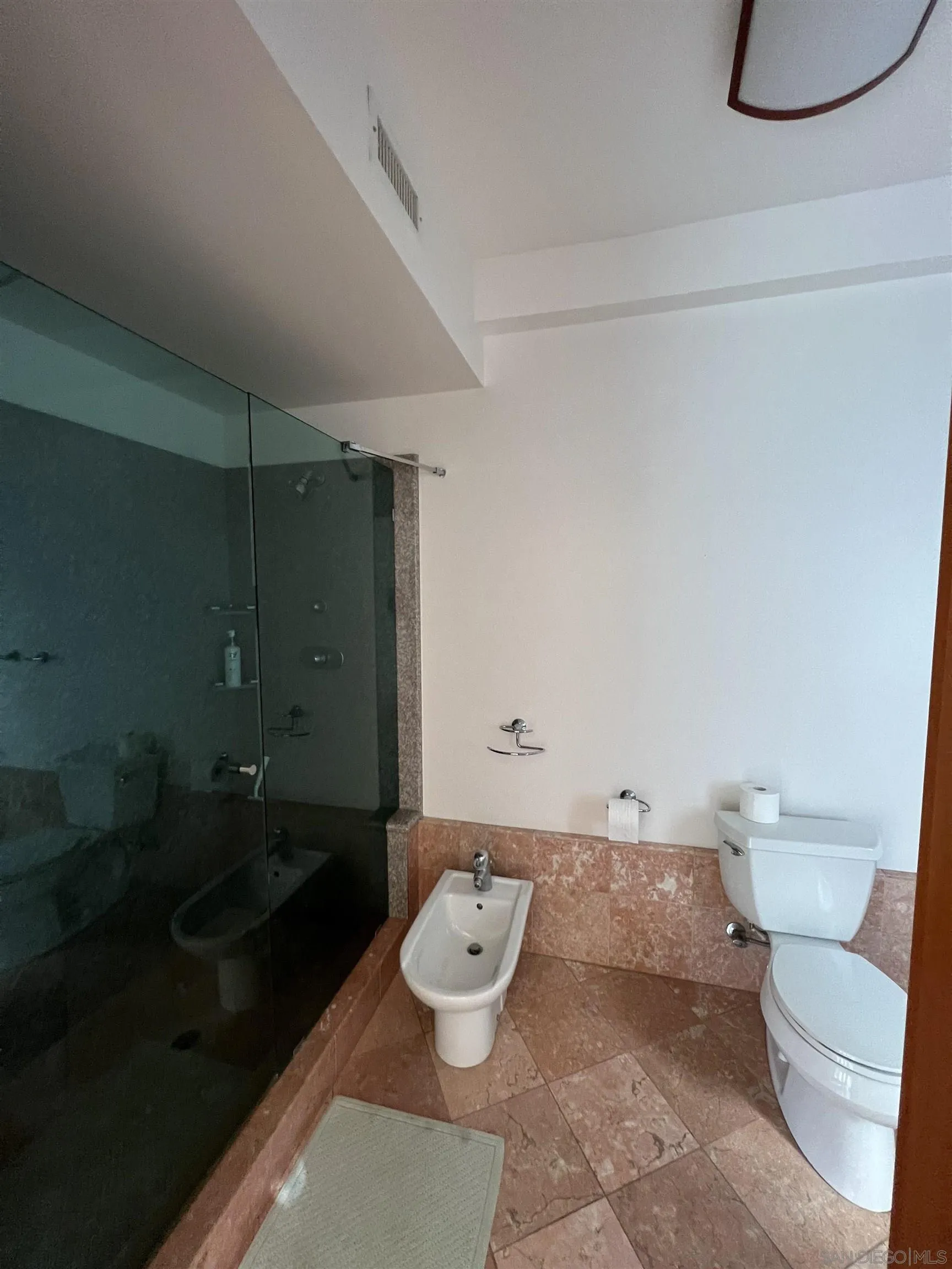 7911 El Paseo Grande La Jolla, CA 92037 - Photo 30 of 32 a bathroom with a toilet and a sink