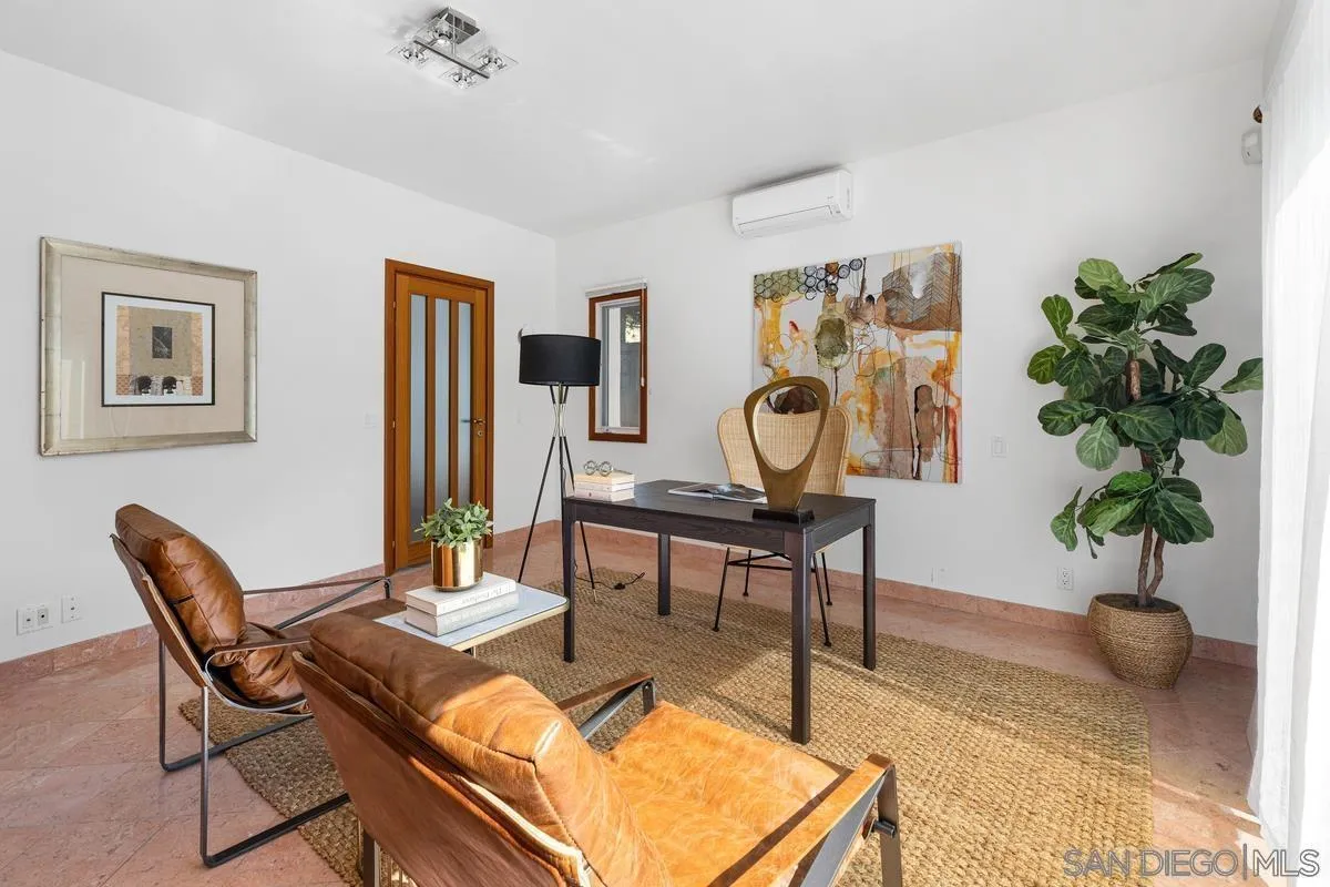 7911 El Paseo Grande La Jolla, CA 92037 - Photo 9 of 32 a living room with furniture and potted plant