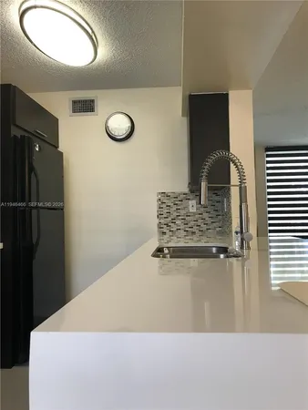 a view of kitchen island with wooden floor