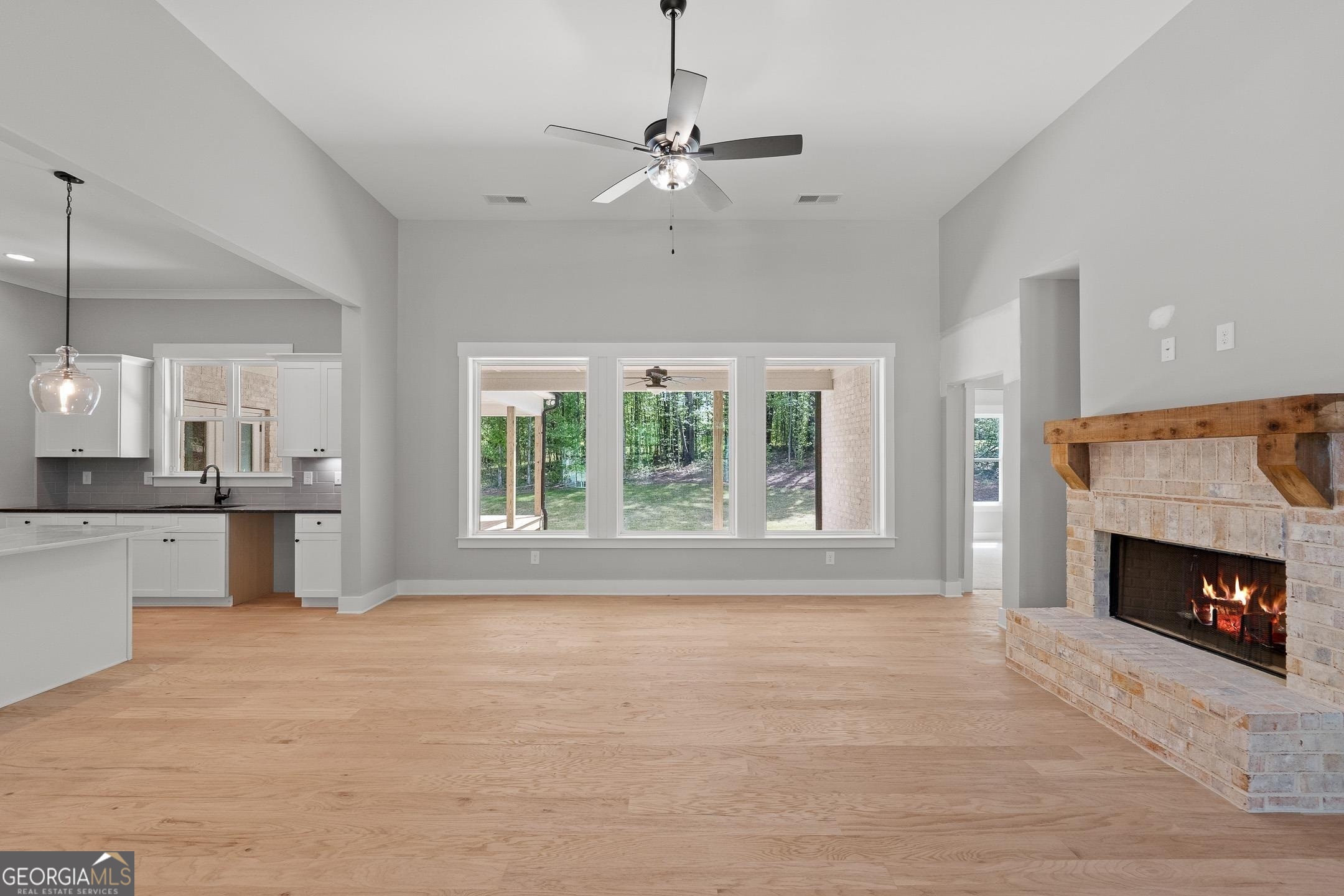 2000 Millstream Court Griffin, GA 30224 - Photo 11 of 49 a view of an empty room with a fireplace and a window