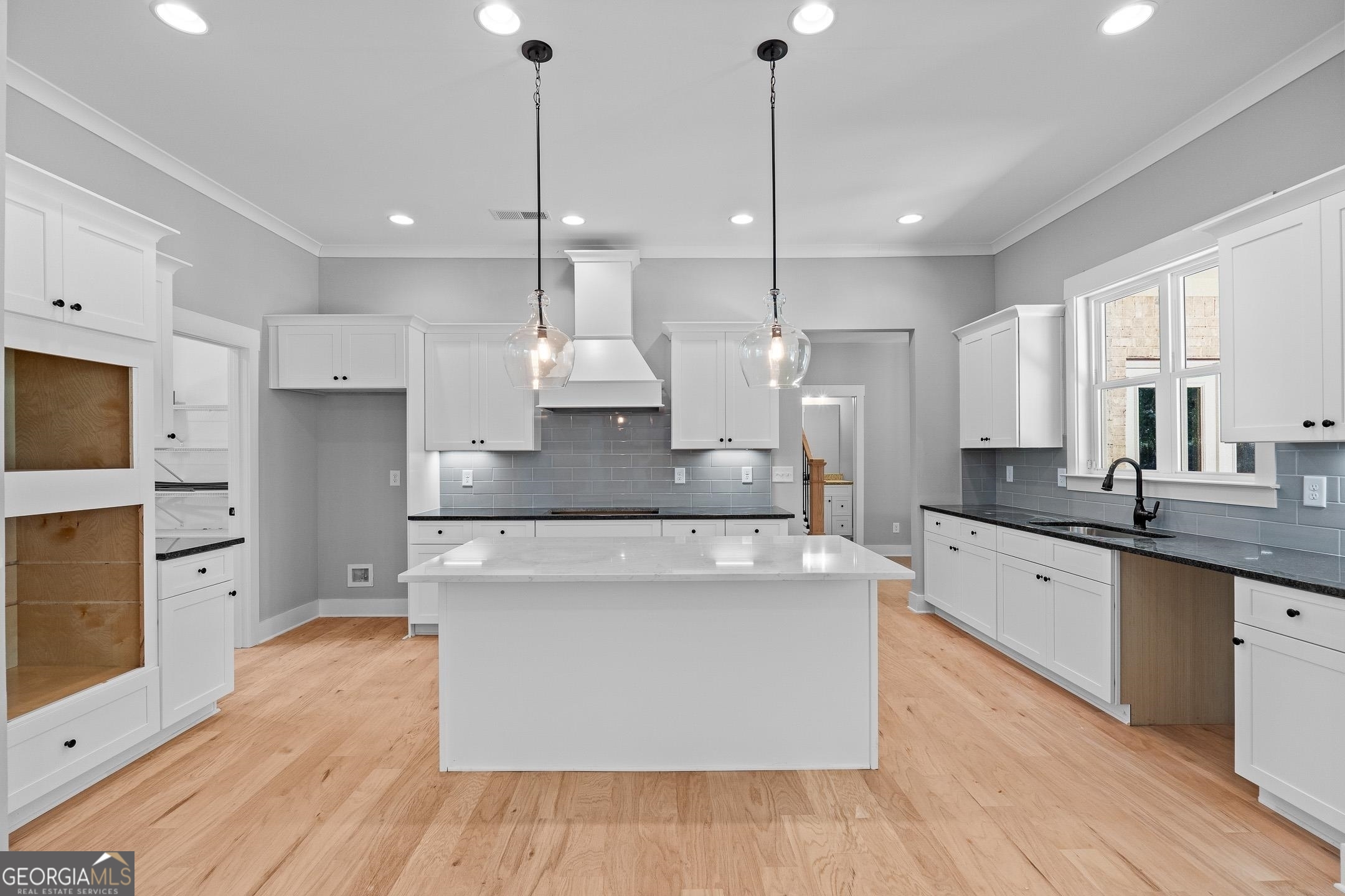 2000 Millstream Court Griffin, GA 30224 - Photo 15 of 49 a large kitchen with stainless steel appliances a large center island attached withe living room