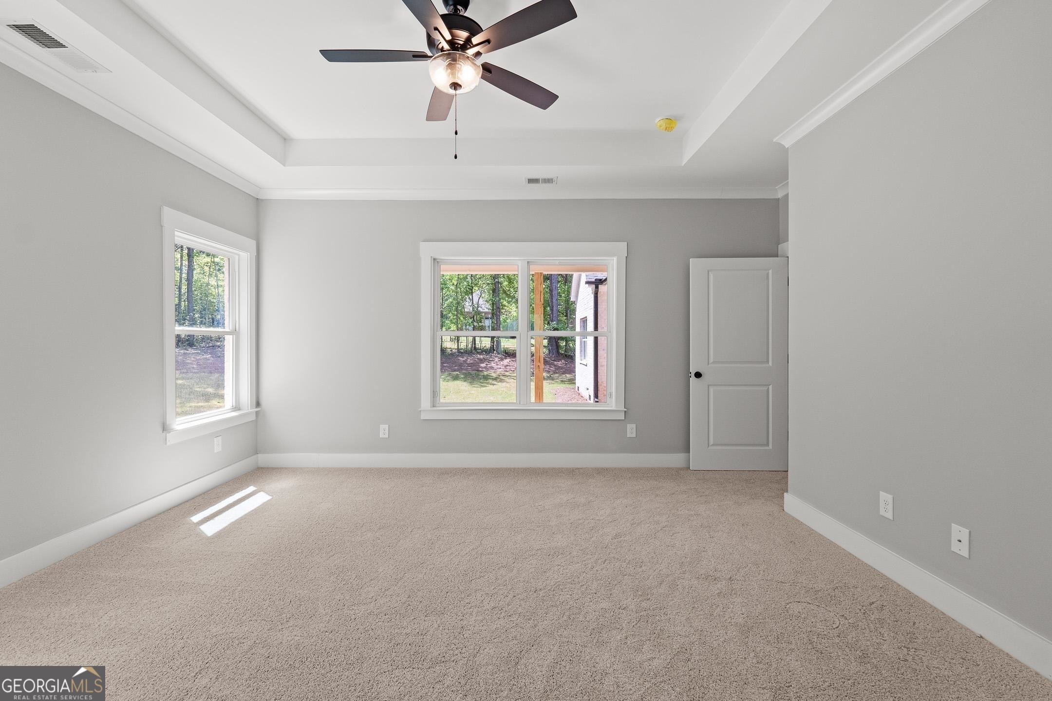 2000 Millstream Court Griffin, GA 30224 - Photo 20 of 49 an empty room with windows and fan
