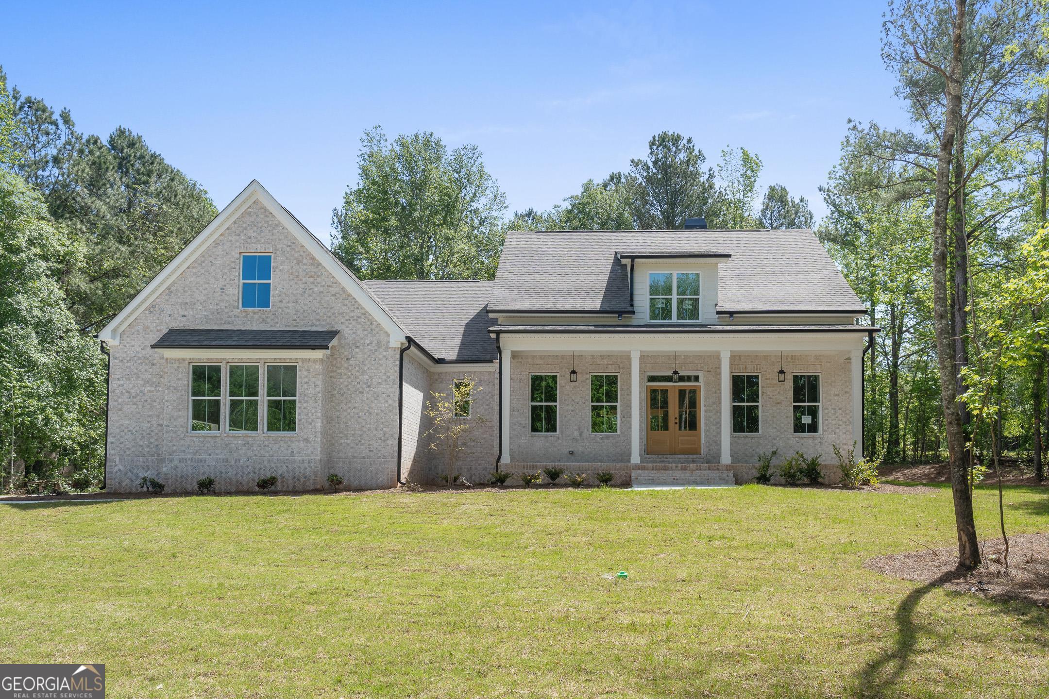 2000 Millstream Court Griffin, GA 30224 - Photo 2 of 49 front view of a house with a yard