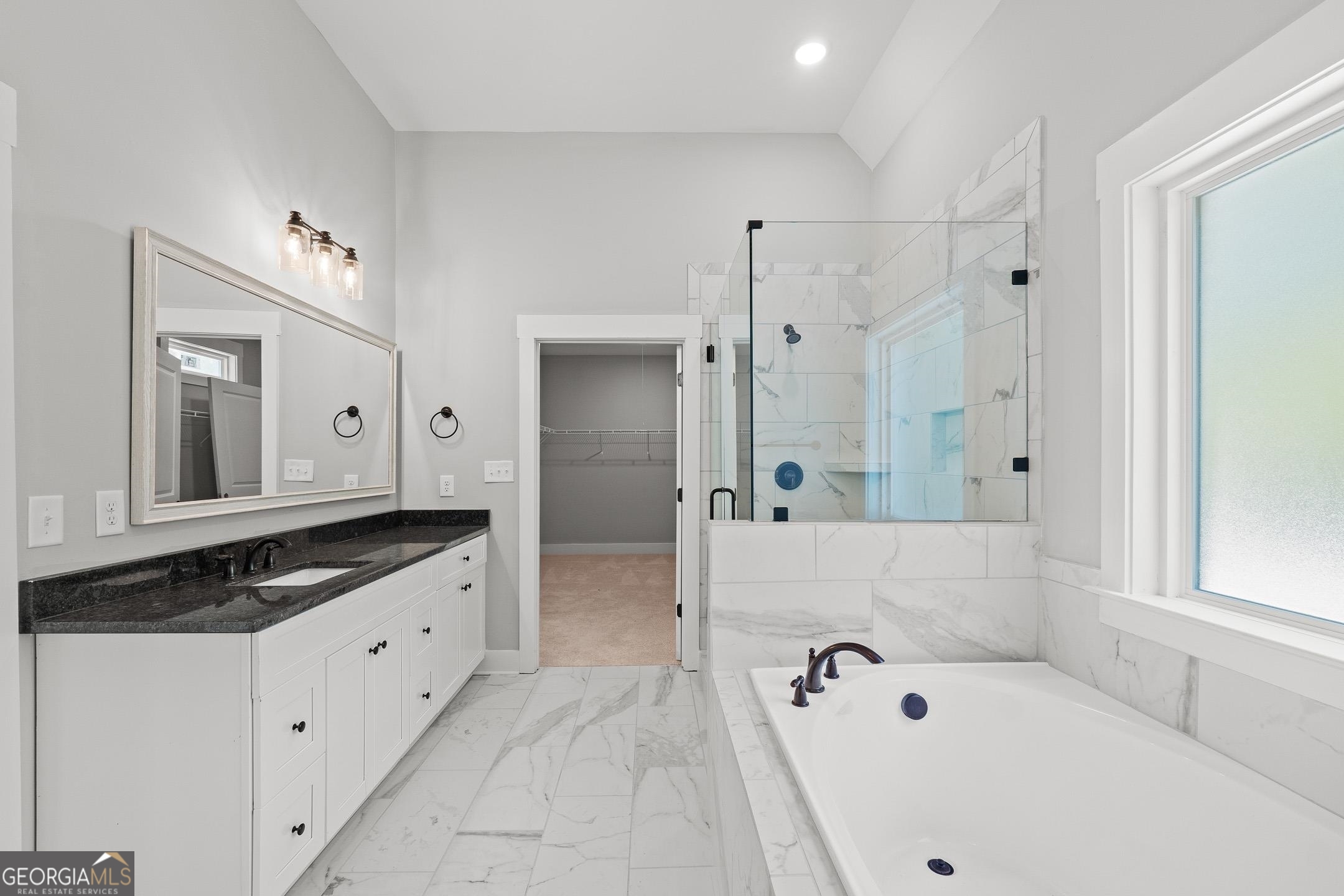 2000 Millstream Court Griffin, GA 30224 - Photo 22 of 49 a bathroom with a tub sink and mirror