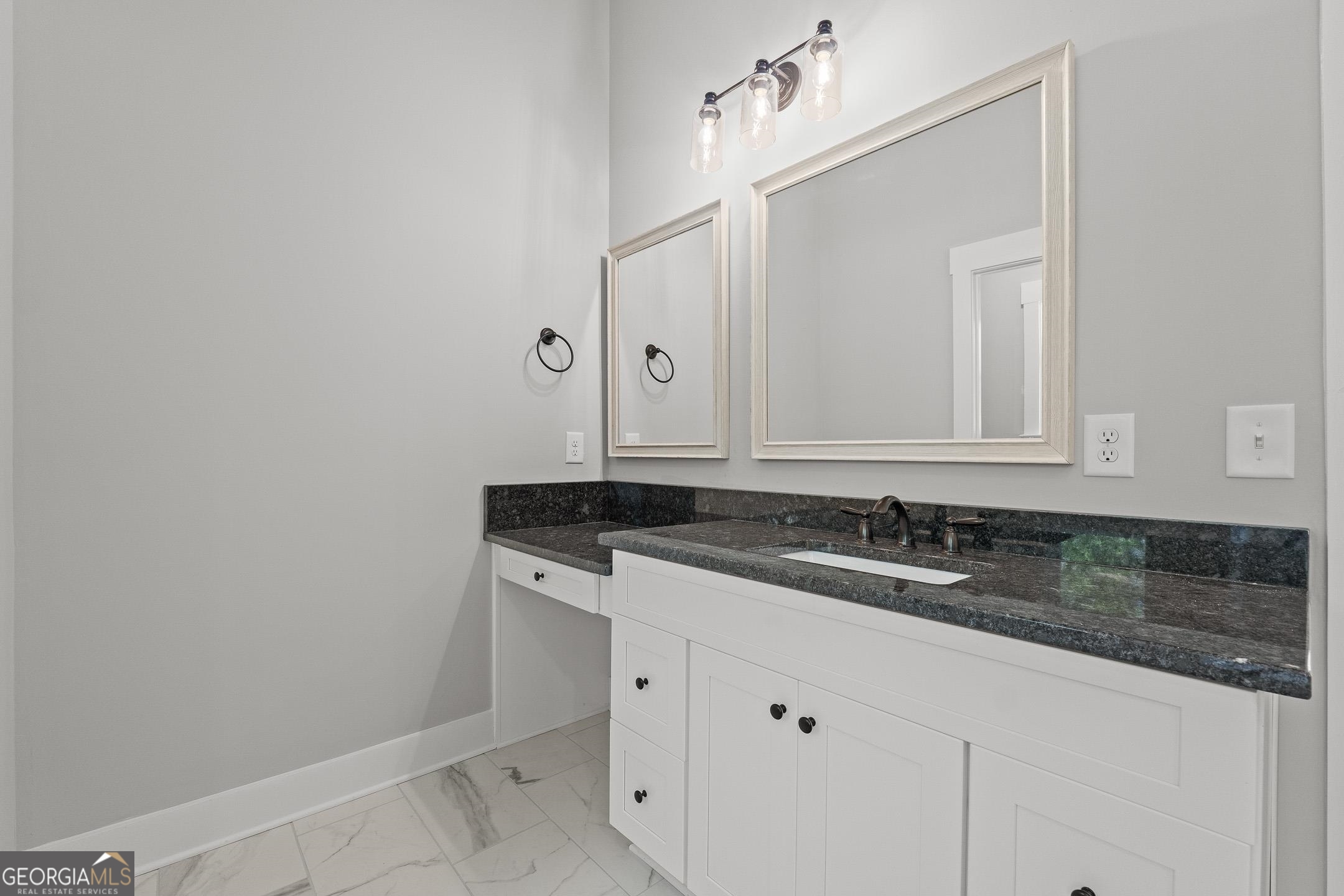 2000 Millstream Court Griffin, GA 30224 - Photo 23 of 49 a bathroom with a sink and a mirror