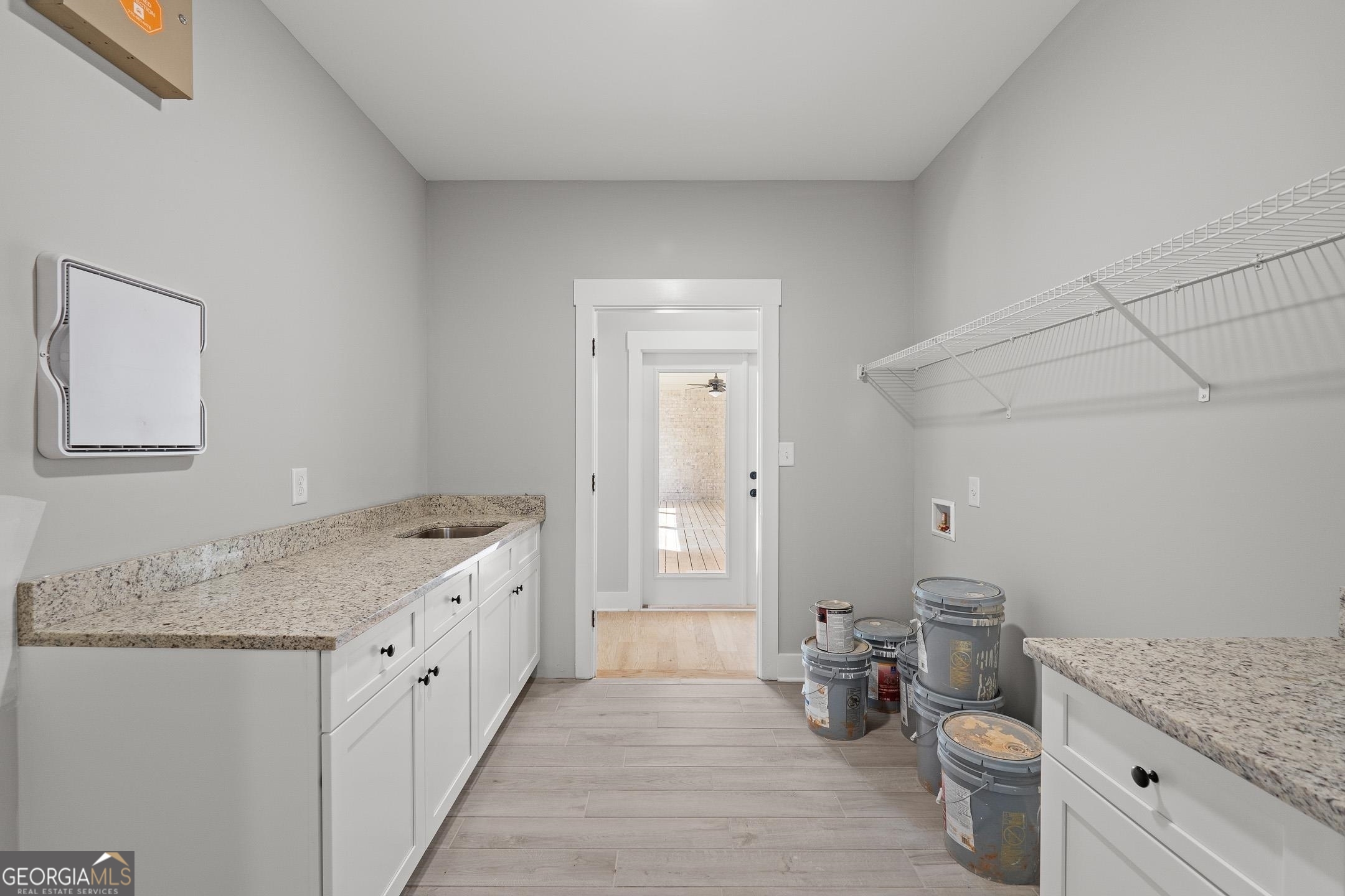 2000 Millstream Court Griffin, GA 30224 - Photo 29 of 49 a bathroom with a granite countertop sink a toilet and a mirror