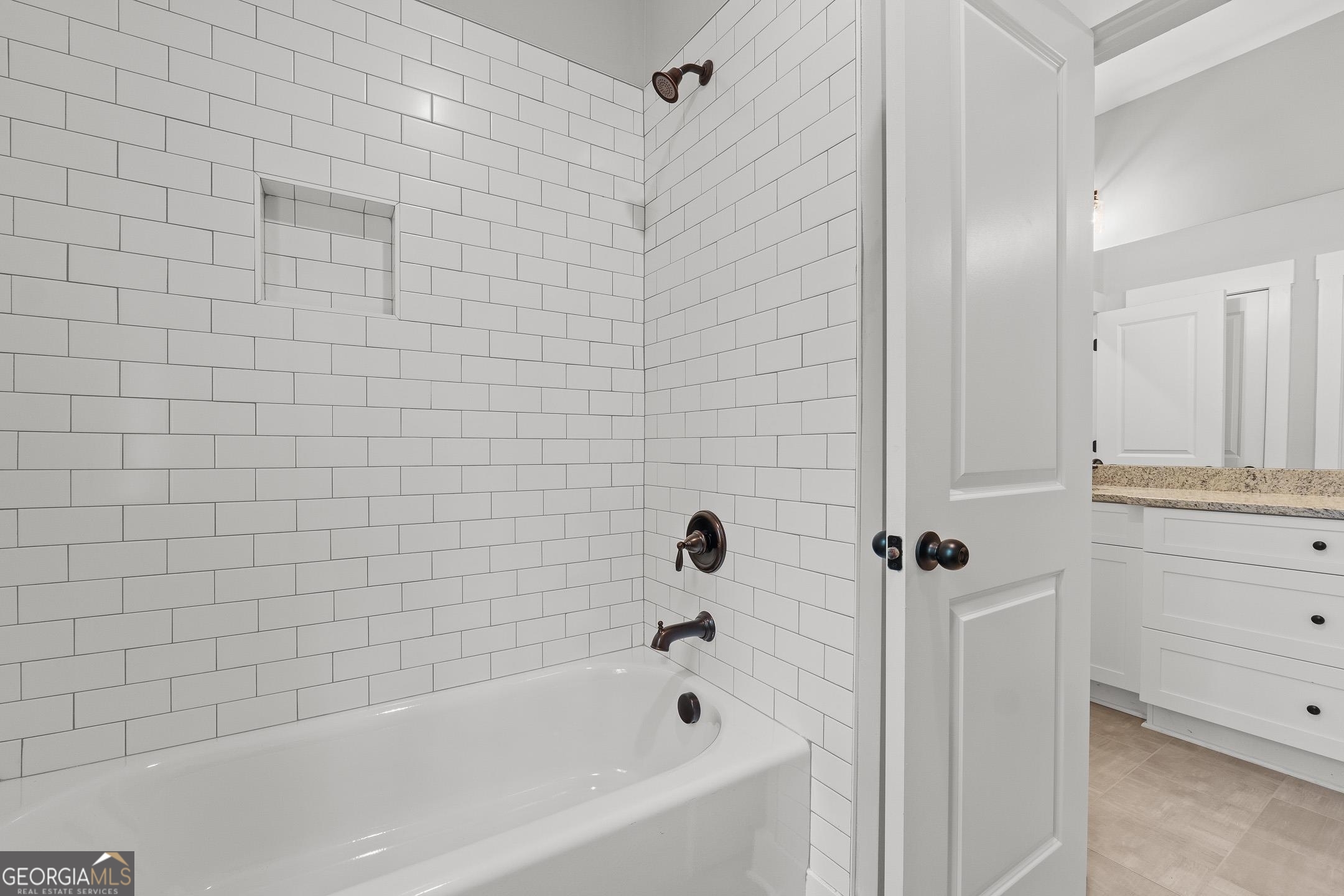 2000 Millstream Court Griffin, GA 30224 - Photo 32 of 49 a bathroom with a bathtub and shower