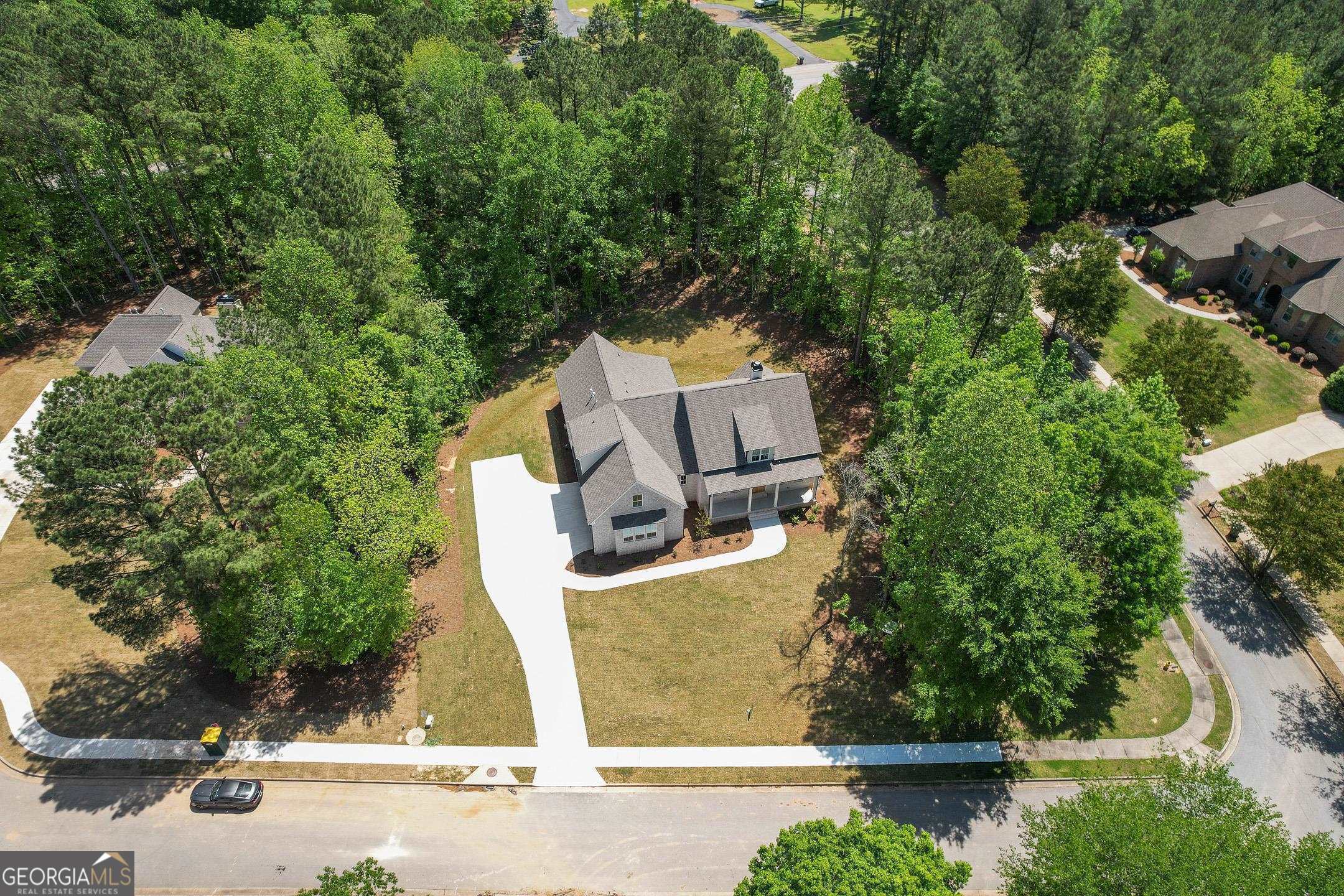 2000 Millstream Court Griffin, GA 30224 - Photo 39 of 49 an aerial view of a house with swimming pool and garden