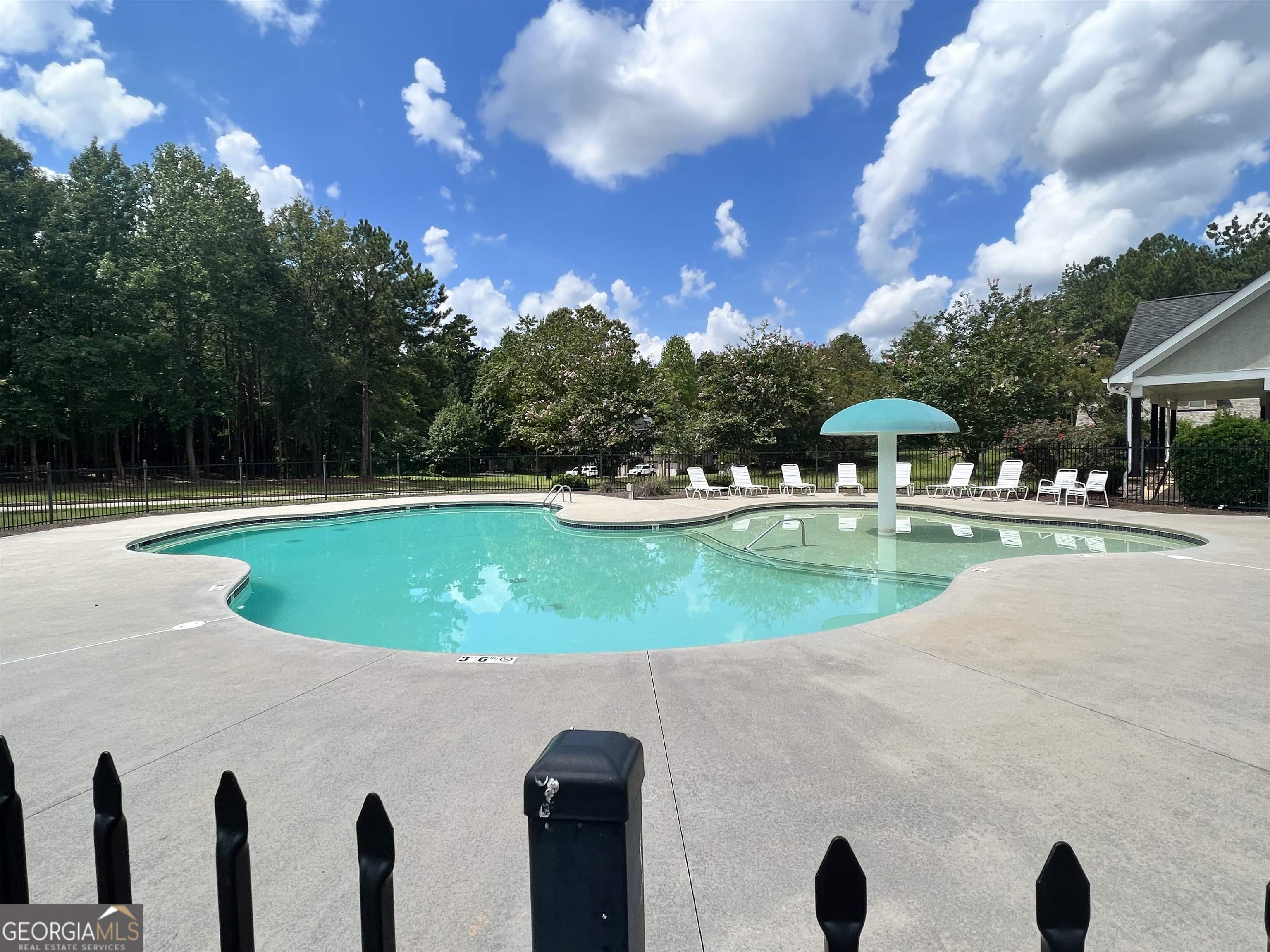 2000 Millstream Court Griffin, GA 30224 - Photo 42 of 49 a view of a swimming pool with a yard