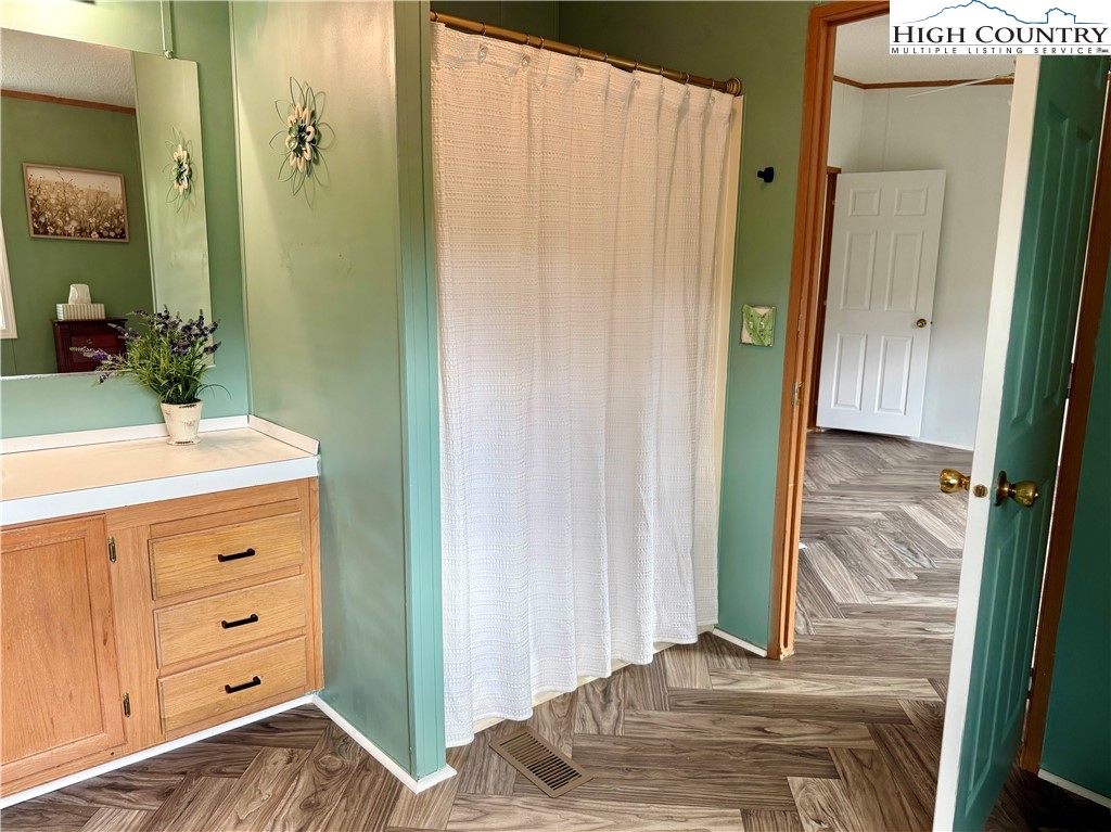 304 The Mulberry Cove Road Boone, NC 28607 - Photo 21 of 45 a bathroom with a sink and a mirror