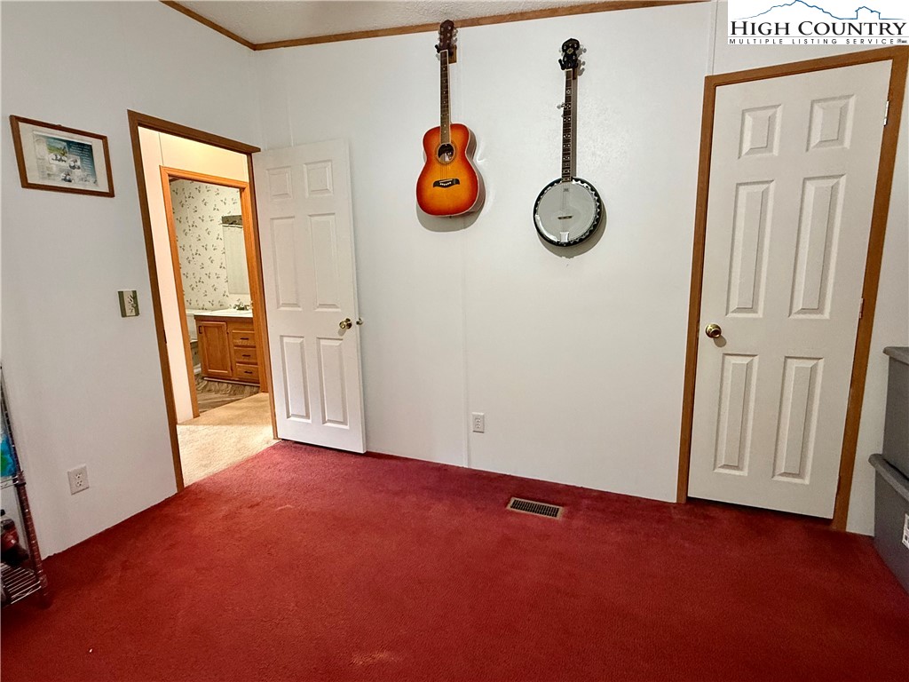 304 The Mulberry Cove Road Boone, NC 28607 - Photo 24 of 45 an empty room with windows