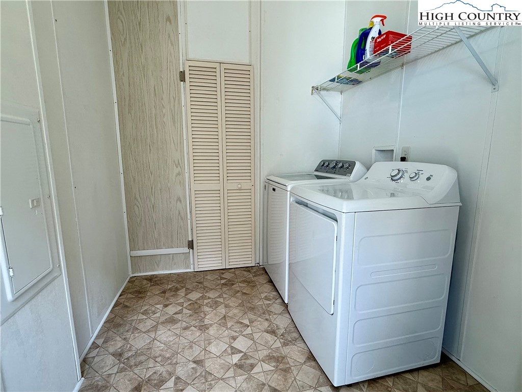 304 The Mulberry Cove Road Boone, NC 28607 - Photo 27 of 45 a storage room with washer and dryer
