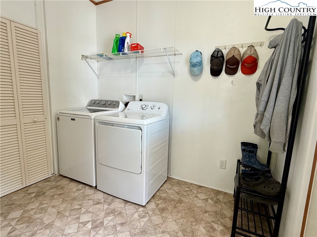 304 The Mulberry Cove Road Boone, NC 28607 - Photo 28 of 45 a view of storage and utility room with washer and dryer