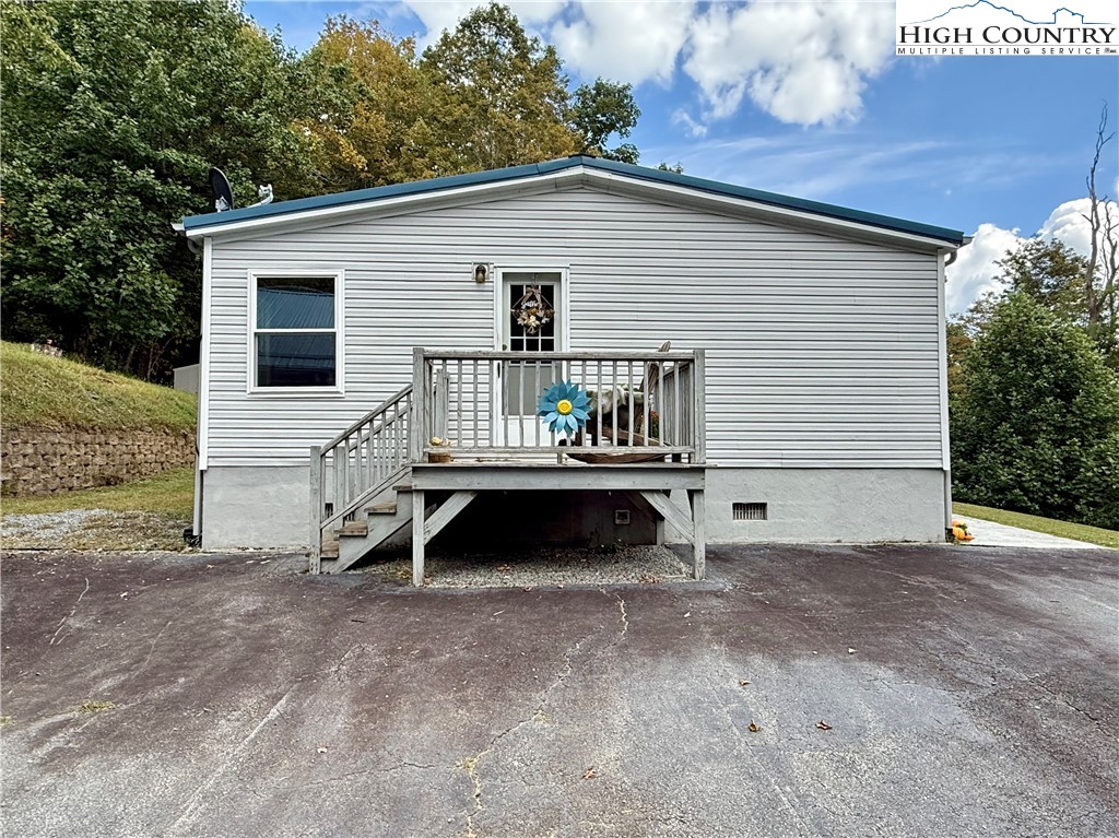 304 The Mulberry Cove Road Boone, NC 28607 - Photo 36 of 45 a view of backyard with a deck and furniture
