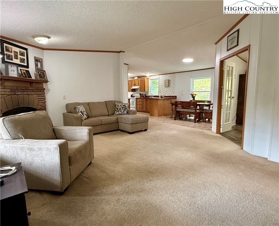 304 The Mulberry Cove Road Boone, NC 28607 - Photo 5 of 45 a living room with furniture and a flat screen tv