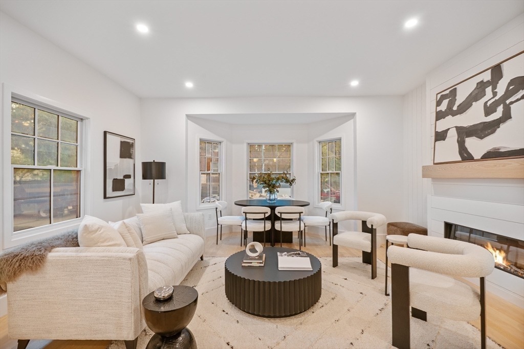 65 Francis Street Brookline, MA 02446 - Photo 14 of 35 a living room with fireplace furniture and a large window
