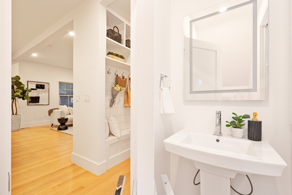 65 Francis Street Brookline, MA 02446 - Photo 15 of 35 a bathroom with a sink and mirror