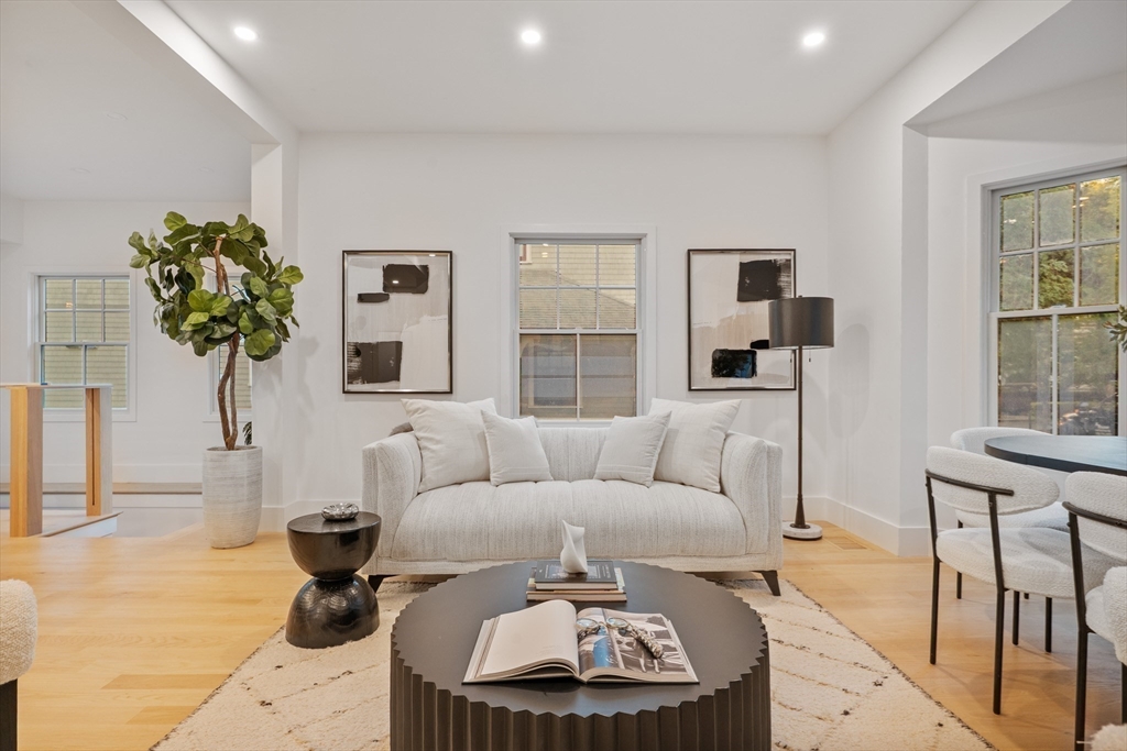 65 Francis Street Brookline, MA 02446 - Photo 3 of 35 a living room with furniture and a window