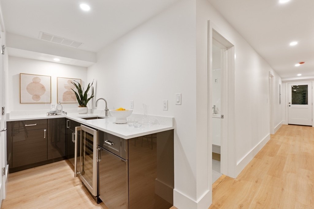65 Francis Street Brookline, MA 02446 - Photo 5 of 35 a kitchen with a sink and cabinets