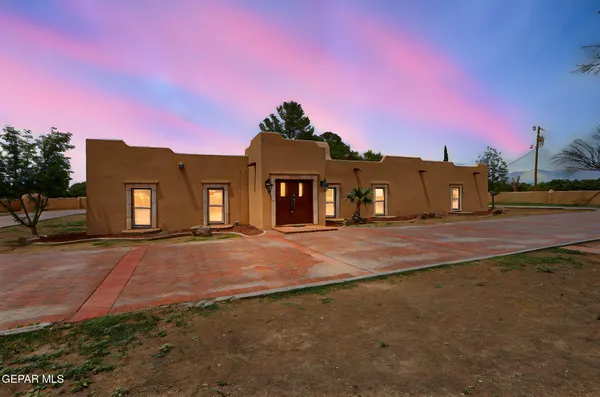 a view of a big house with a big yard