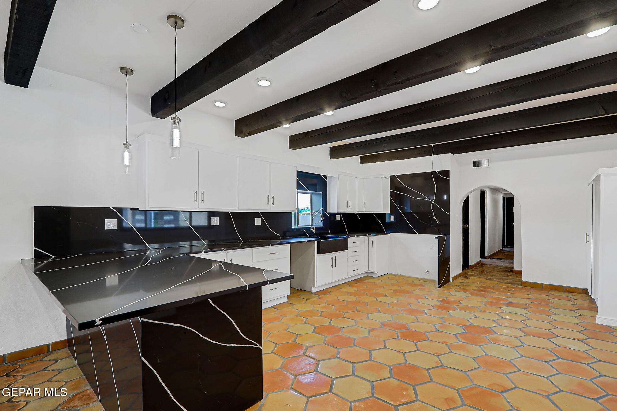1067 Gardner Road El Paso, TX 79932 - Photo 11 of 59 a kitchen with stainless steel appliances a stove a sink and cabinets