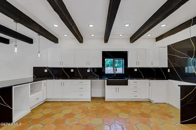 a bedroom with a bed and a potted plant