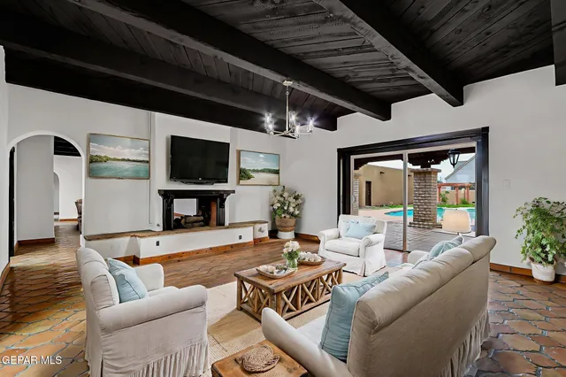 a view of a house with a backyard and basketball court