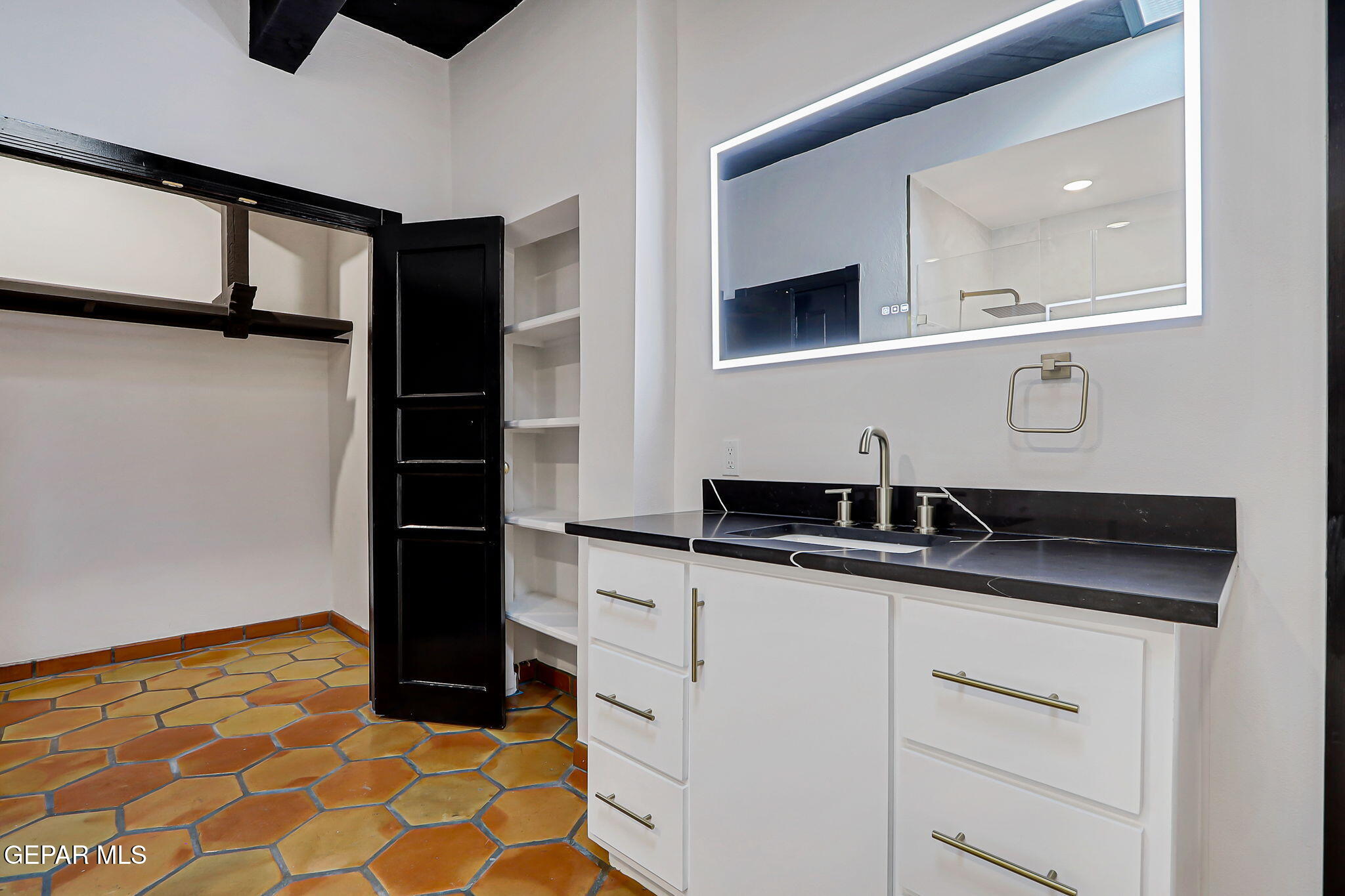 1067 Gardner Road El Paso, TX 79932 - Photo 31 of 59 a kitchen with a sink and a refrigerator