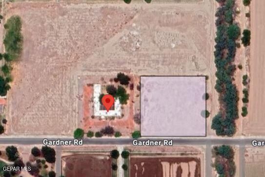 1067 Gardner Road El Paso, TX 79932 - Photo 44 of 59 view of a with a wall and potted plants