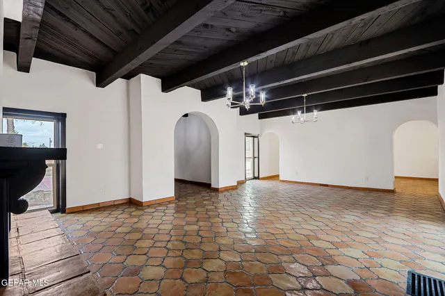 a kitchen with stainless steel appliances a stove a sink and cabinets