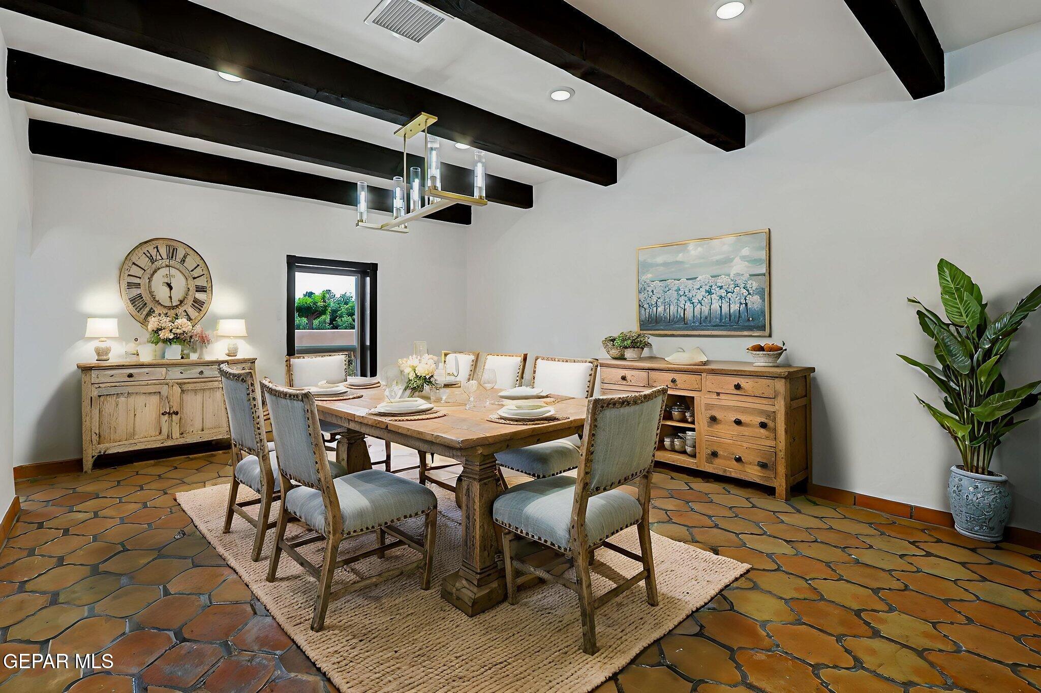 1067 Gardner Road El Paso, TX 79932 - Photo 8 of 59 a view of a dining room with furniture and a potted plant