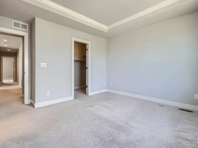 an empty room with closet area