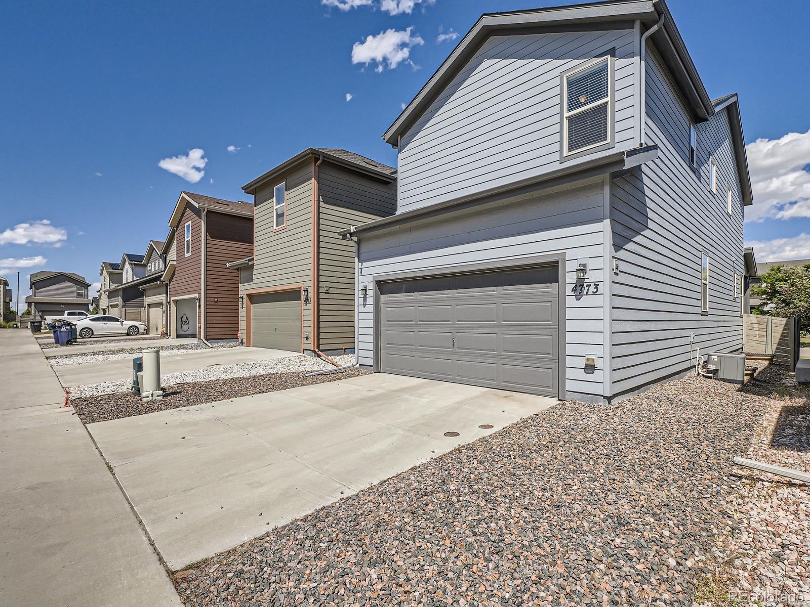 4773 Kittredge Street Denver, CO 80239 - Photo 26 of 32 a view of a house with a patio