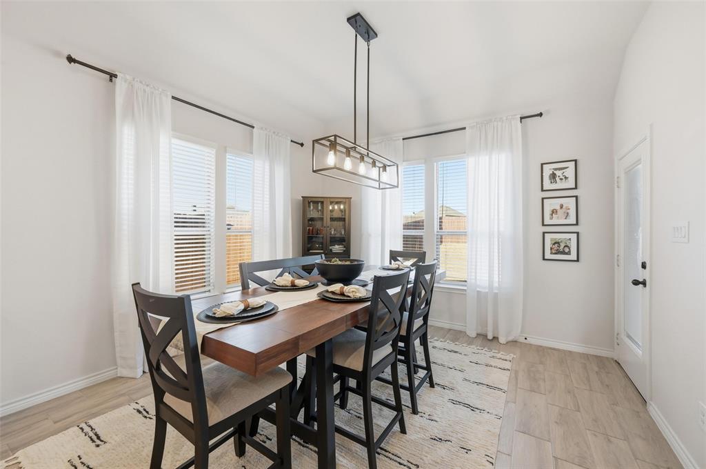 4425 Dandelion Lane Midlothian, TX 76065 - Photo 18 of 40 a view of a dining room with furniture window and wooden floor
