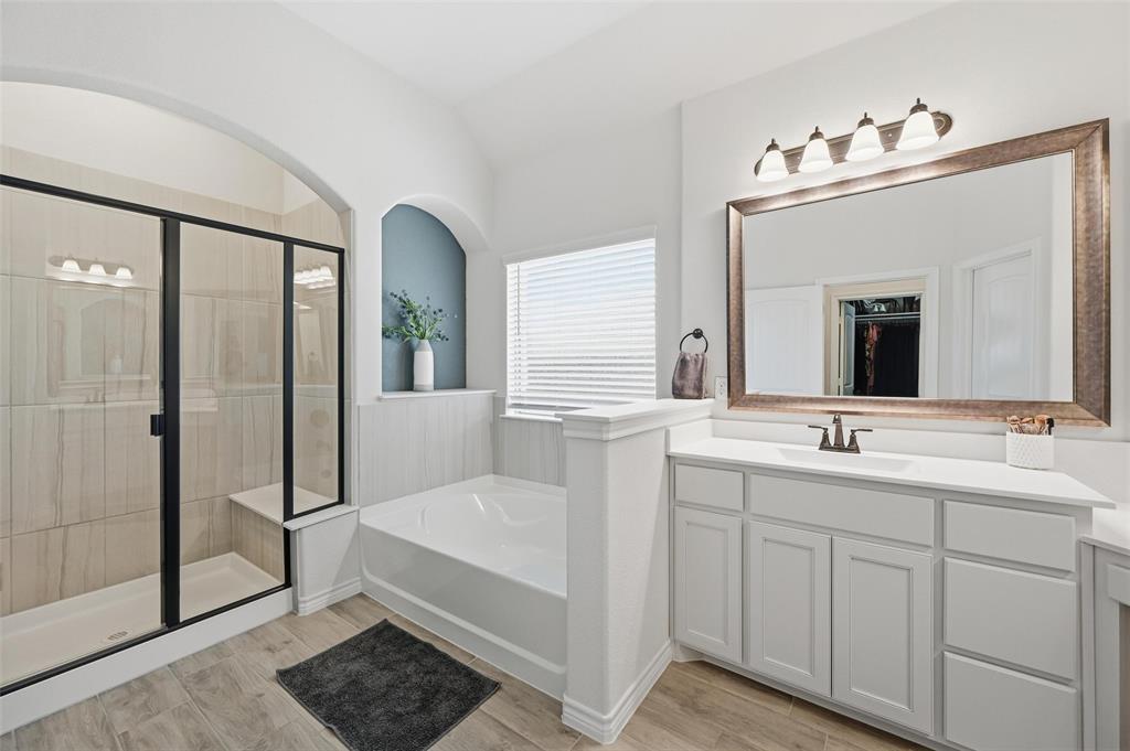4425 Dandelion Lane Midlothian, TX 76065 - Photo 22 of 40 a bathroom with a double vanity sink and mirror
