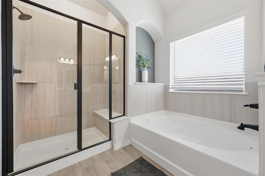 4425 Dandelion Lane Midlothian, TX 76065 - Photo 24 of 40 a bathroom with a bathtub and a shower