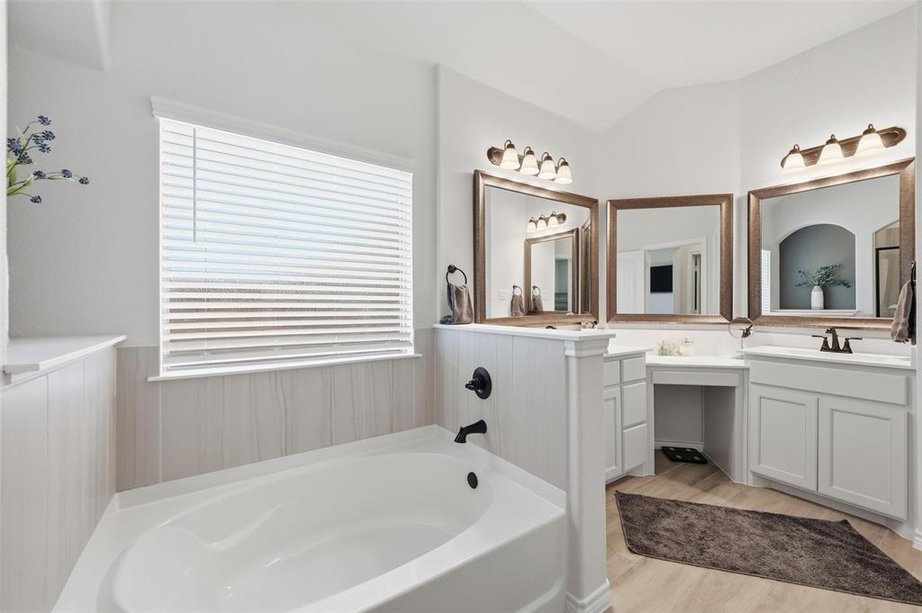 4425 Dandelion Lane Midlothian, TX 76065 - Photo 25 of 40 a spacious bathroom with a tub sink and mirror