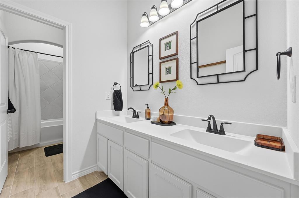 4425 Dandelion Lane Midlothian, TX 76065 - Photo 30 of 40 a bathroom with a sink and a mirror