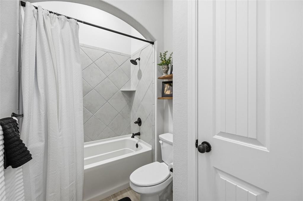 4425 Dandelion Lane Midlothian, TX 76065 - Photo 31 of 40 a bathroom with a shower and a toilet